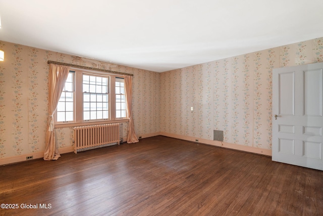 2125 Rosendale Rd, Niskayuna, NY 12309 - spare room with radiator heating unit, wood finished floors, wallpapered walls, and baseboards
