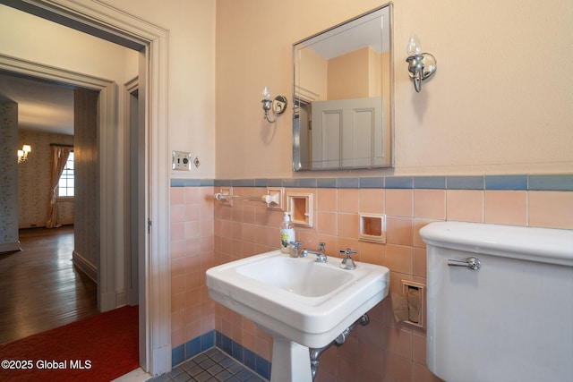 2125 Rosendale Rd, Niskayuna, NY 12309 - half bath featuring wainscoting, tile walls, and a sink