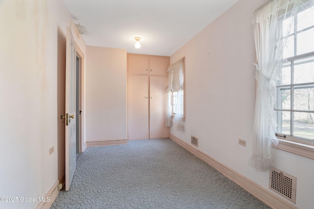 2125 Rosendale Rd, Niskayuna, NY 12309 - unfurnished bedroom with light carpet, a closet, and baseboards