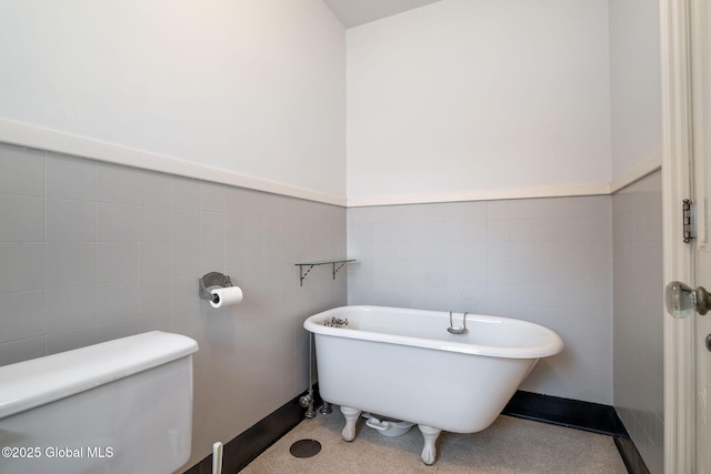 2125 Rosendale Rd, Niskayuna, NY 12309 - bathroom with a freestanding tub, tile walls, and toilet