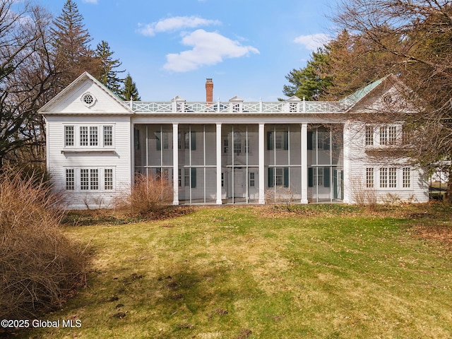 2125 Rosendale Rd, Niskayuna, NY 12309 - rear view of property with a chimney, a sunroom, and a yard