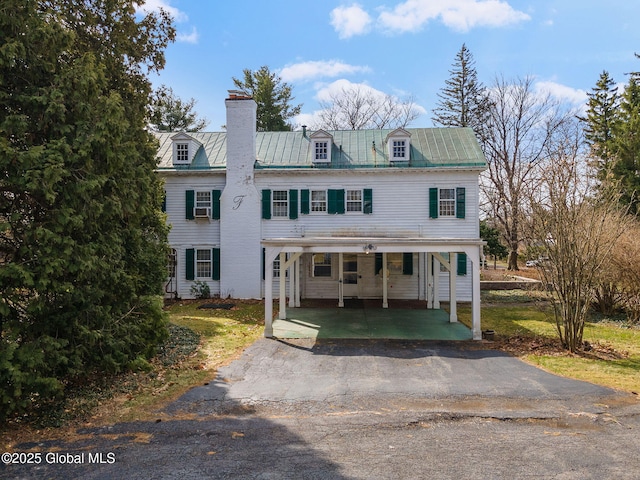 2125 Rosendale Rd, Niskayuna, NY 12309 - view of front of property featuring asphalt driveway, a chimney, and metal roof