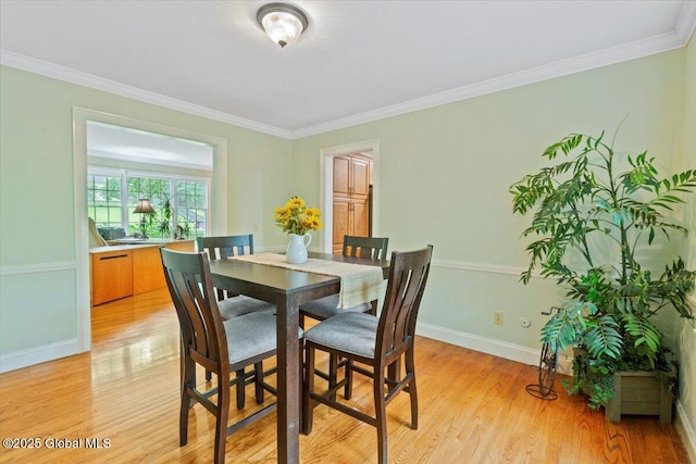 19 Canterbury Rd, Clifton Park, NY 12065 - dining area with light wood finished floors and crown molding