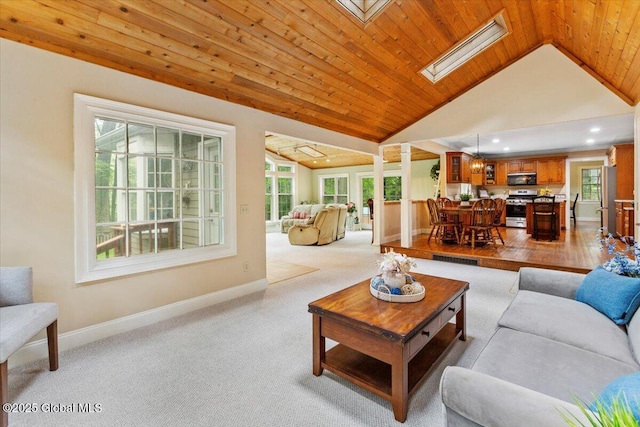 19 Canterbury Rd, Clifton Park, NY 12065 - living room with vaulted ceiling, recessed lighting, a skylight, carpet flooring, and wood ceiling