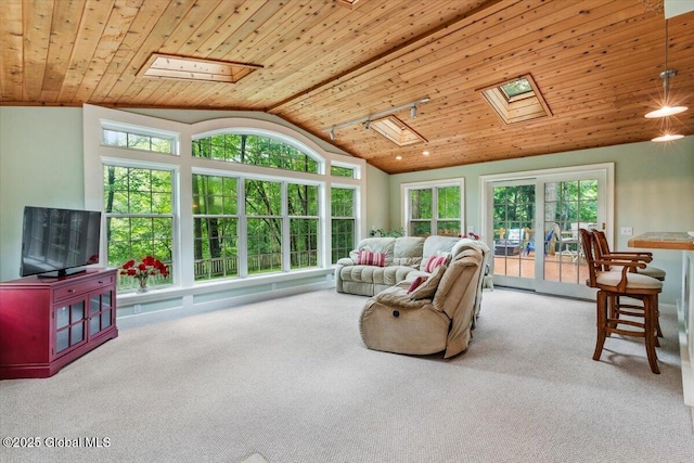 19 Canterbury Rd, Clifton Park, NY 12065 - carpeted living room featuring a skylight, vaulted ceiling, and wood ceiling
