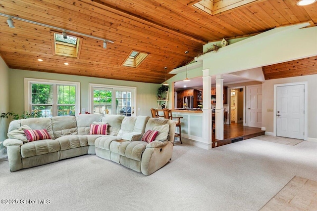 19 Canterbury Rd, Clifton Park, NY 12065 - living area featuring a skylight, carpet, lofted ceiling, wooden ceiling, and recessed lighting