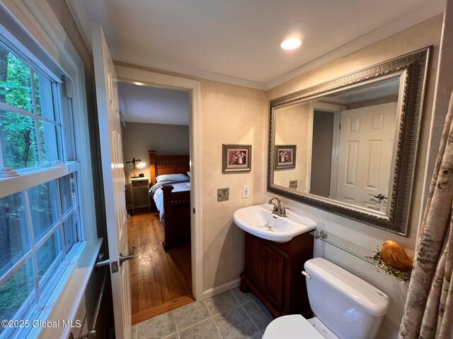 19 Canterbury Rd, Clifton Park, NY 12065 - ensuite bathroom featuring vanity, tile patterned flooring, and ornamental molding
