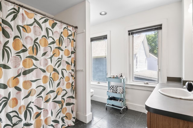 30 Monument Ave, Glens Falls, NY 12801 - bathroom featuring toilet, vanity, baseboards, recessed lighting, and a shower with shower curtain
