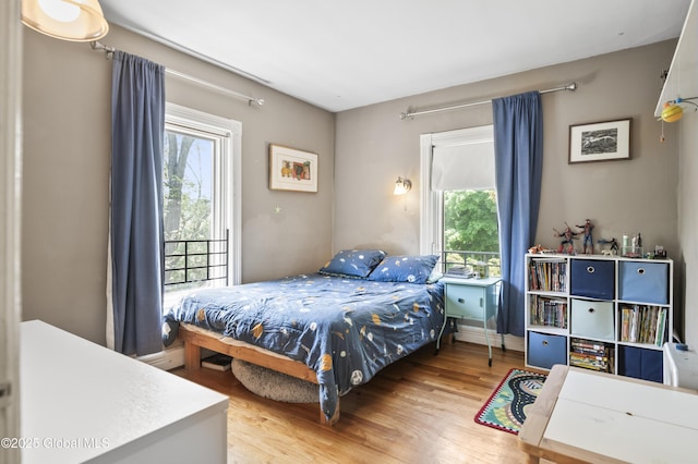 30 Monument Ave, Glens Falls, NY 12801 - bedroom with multiple windows and wood finished floors
