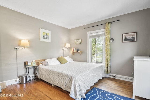 30 Monument Ave, Glens Falls, NY 12801 - bedroom featuring wood finished floors, baseboards, and crown molding