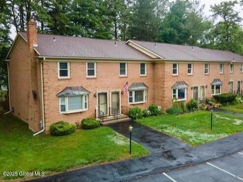 198 Williamsburg Ct, Albany, NY 12203 - view of property with a chimney and a front yard