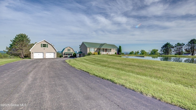 127 Firefly Meadow Rd, Glen, NY 12072 - view of front of house featuring a water view, an outdoor structure, a front yard, a gambrel roof, and asphalt driveway