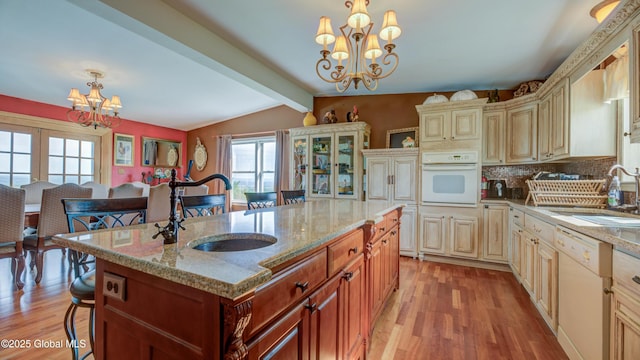 127 Firefly Meadow Rd, Glen, NY 12072 - kitchen with a chandelier, white appliances, cream cabinetry, and a sink