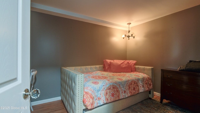 127 Firefly Meadow Rd, Glen, NY 12072 - bedroom featuring baseboards, a chandelier, and wood finished floors