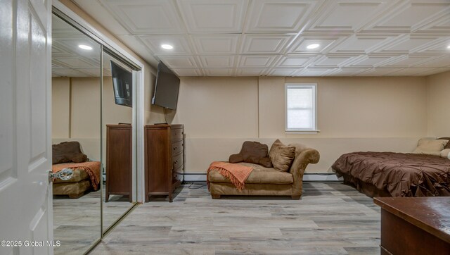 127 Firefly Meadow Rd, Glen, NY 12072 - bedroom featuring baseboard heating, a baseboard radiator, light wood-type flooring, recessed lighting, and an ornate ceiling