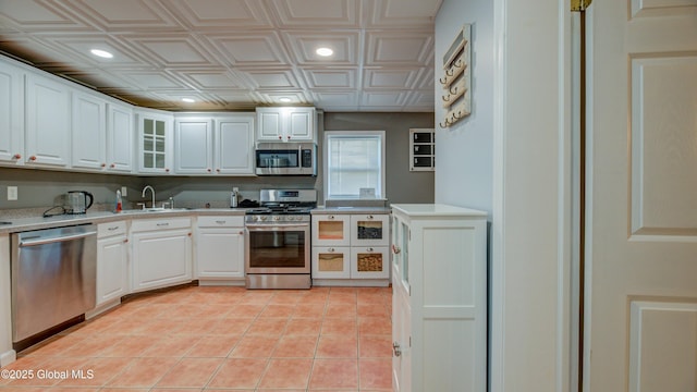 127 Firefly Meadow Rd, Glen, NY 12072 - kitchen with stainless steel appliances, a sink, an ornate ceiling, light countertops, and glass insert cabinets