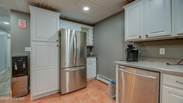 127 Firefly Meadow Rd, Glen, NY 12072 - kitchen with stainless steel appliances, baseboard heating, recessed lighting, light countertops, and white cabinetry