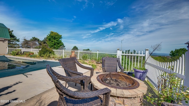 127 Firefly Meadow Rd, Glen, NY 12072 - fenced backyard featuring an outdoor fire pit and a patio area