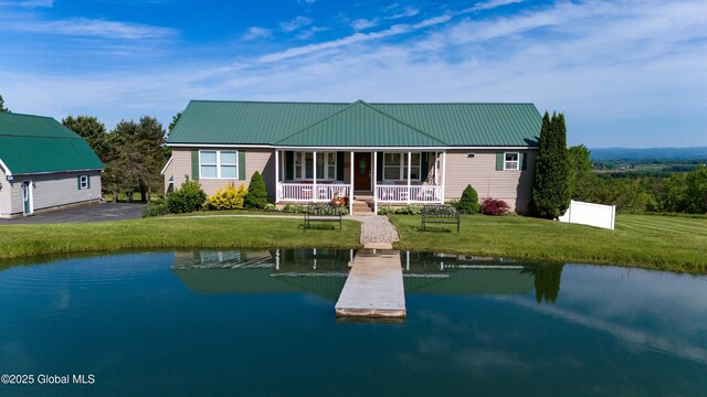 127 Firefly Meadow Rd, Glen, NY 12072 - view of front of home with a boat dock, a front lawn, a porch, and metal roof