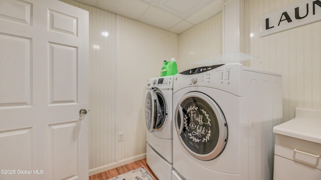 127 Firefly Meadow Rd, Glen, NY 12072 - laundry room featuring washing machine and clothes dryer, light wood-style floors, and baseboards