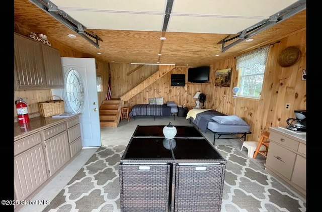 127 Firefly Meadow Rd, Glen, NY 12072 - living room with wooden walls, a garage, and stairs