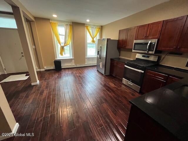 201 10th St, Troy, NY 12180 - kitchen with appliances with stainless steel finishes, dark countertops, healthy amount of natural light, dark wood-style floors, and recessed lighting