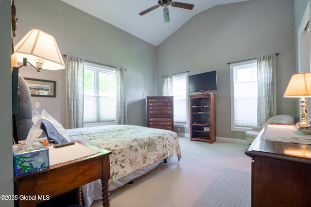 26 Galleon Dr Unit 26, Malta, NY 12020 - carpeted bedroom featuring multiple windows, baseboards, high vaulted ceiling, and a ceiling fan