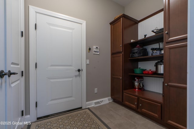 26 Galleon Dr Unit 26, Malta, NY 12020 - entryway with baseboards and light tile patterned floors