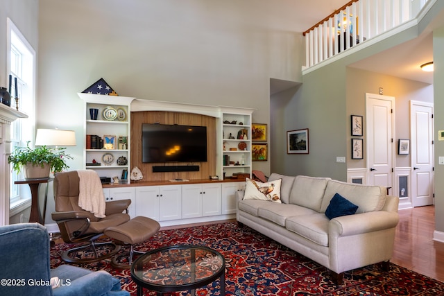 26 Galleon Dr Unit 26, Malta, NY 12020 - living area featuring a towering ceiling and wood finished floors