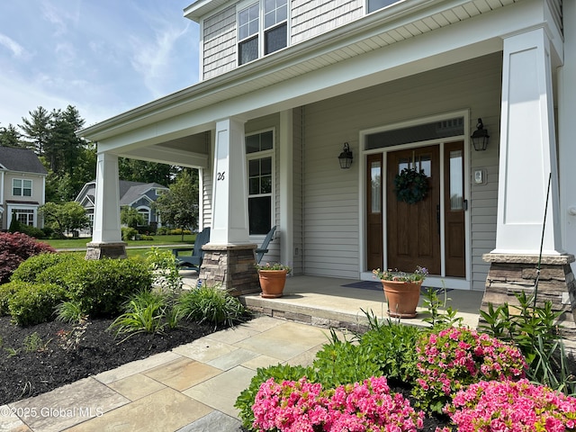26 Galleon Dr Unit 26, Malta, NY 12020 - doorway to property with a porch
