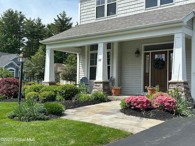 26 Galleon Dr Unit 26, Malta, NY 12020 - view of exterior entry with a shingled roof and a porch
