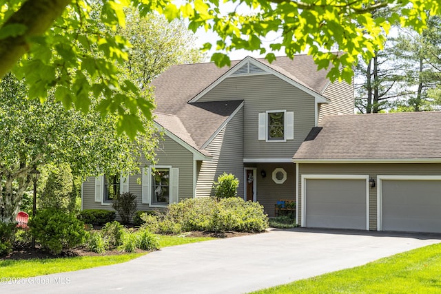 844 Red Oak Dr, Niskayuna, NY 12309 - view of front of home featuring a garage, a shingled roof, and asphalt driveway