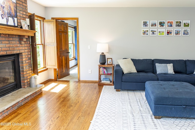 844 Red Oak Dr, Niskayuna, NY 12309 - living area featuring wood finished floors, a fireplace, and baseboards