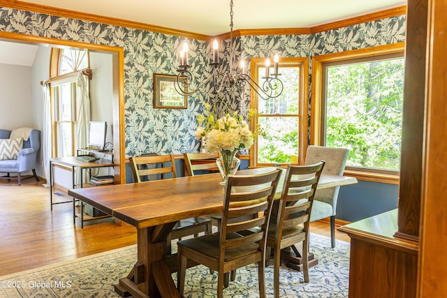 844 Red Oak Dr, Niskayuna, NY 12309 - dining room featuring wallpapered walls, light wood-style flooring, plenty of natural light, a chandelier, and crown molding
