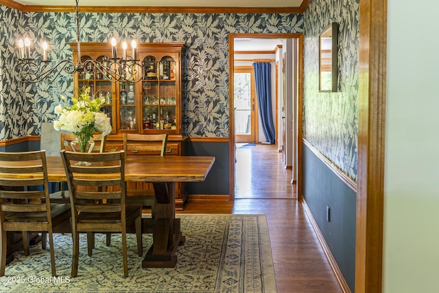 844 Red Oak Dr, Niskayuna, NY 12309 - dining room featuring wallpapered walls, baseboards, ornamental molding, wood finished floors, and a chandelier