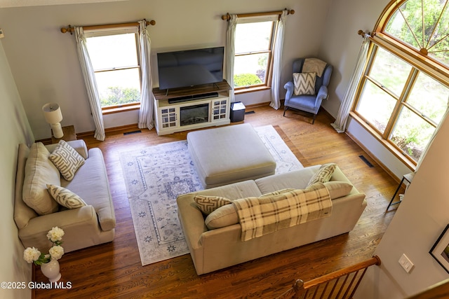 844 Red Oak Dr, Niskayuna, NY 12309 - living area featuring healthy amount of natural light, wood finished floors, and baseboards