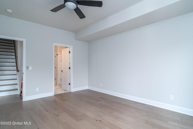 16 Priddle Ln, Colonie, NY 12110 - unfurnished bedroom with a walk in closet, wood finished floors, baseboards, ensuite bath, and a closet