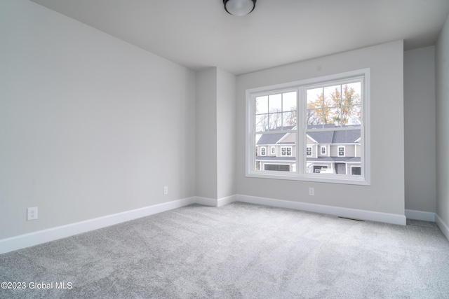 16 Priddle Ln, Colonie, NY 12110 - spare room featuring carpet floors and baseboards
