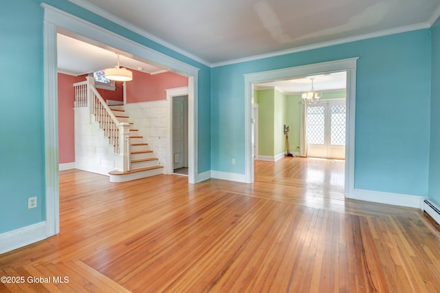 1348 Union St, Schenectady, NY 12308 - unfurnished room with a chandelier, stairway, crown molding, baseboards, and wood-type flooring