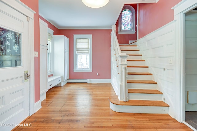 1348 Union St, Schenectady, NY 12308 - entrance foyer featuring a baseboard radiator, stairway, plenty of natural light, light wood-style flooring, and ornamental molding