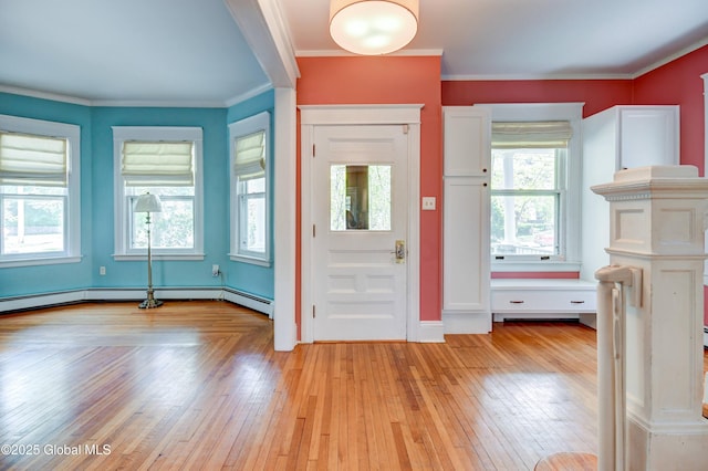 1348 Union St, Schenectady, NY 12308 - foyer with light wood-style flooring, ornamental molding, and a baseboard heating unit