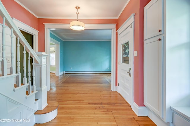1348 Union St, Schenectady, NY 12308 - hall featuring a baseboard heating unit, crown molding, stairs, light wood-style floors, and baseboards