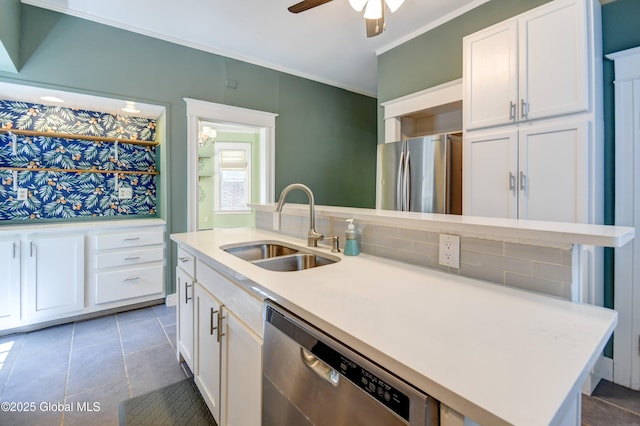 1348 Union St, Schenectady, NY 12308 - kitchen featuring a sink, stainless steel appliances, an island with sink, white cabinetry, and ornamental molding