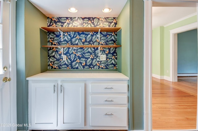1348 Union St, Schenectady, NY 12308 - bar area featuring light wood-style floors, baseboard heating, recessed lighting, baseboards, and crown molding