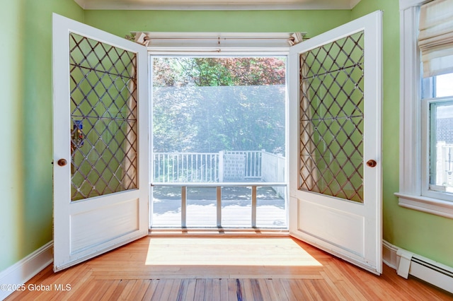 1348 Union St, Schenectady, NY 12308 - foyer with a baseboard heating unit and light wood-style flooring
