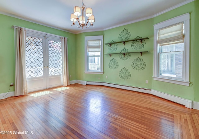 1348 Union St, Schenectady, NY 12308 - unfurnished room with french doors, a chandelier, hardwood / wood-style flooring, a baseboard heating unit, and crown molding