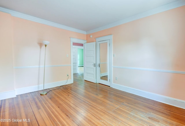 1348 Union St, Schenectady, NY 12308 - empty room with baseboards, wood finished floors, and crown molding