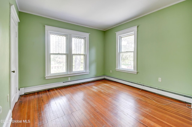1348 Union St, Schenectady, NY 12308 - empty room featuring hardwood / wood-style floors, ornamental molding, baseboards, and a baseboard heating unit