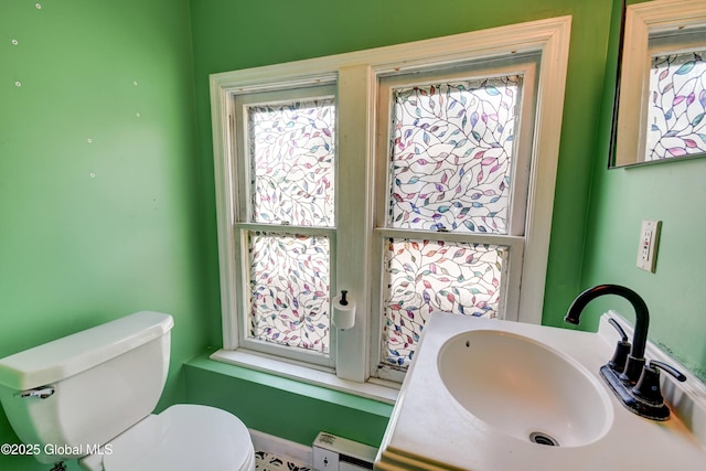 1348 Union St, Schenectady, NY 12308 - half bathroom with a baseboard radiator, toilet, and vanity