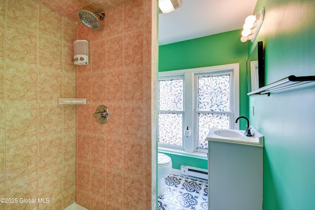 1348 Union St, Schenectady, NY 12308 - bathroom with a baseboard radiator, tiled shower, toilet, tile patterned flooring, and vanity